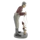 Dekorace muž s loutkou Pinocchio 36 cm